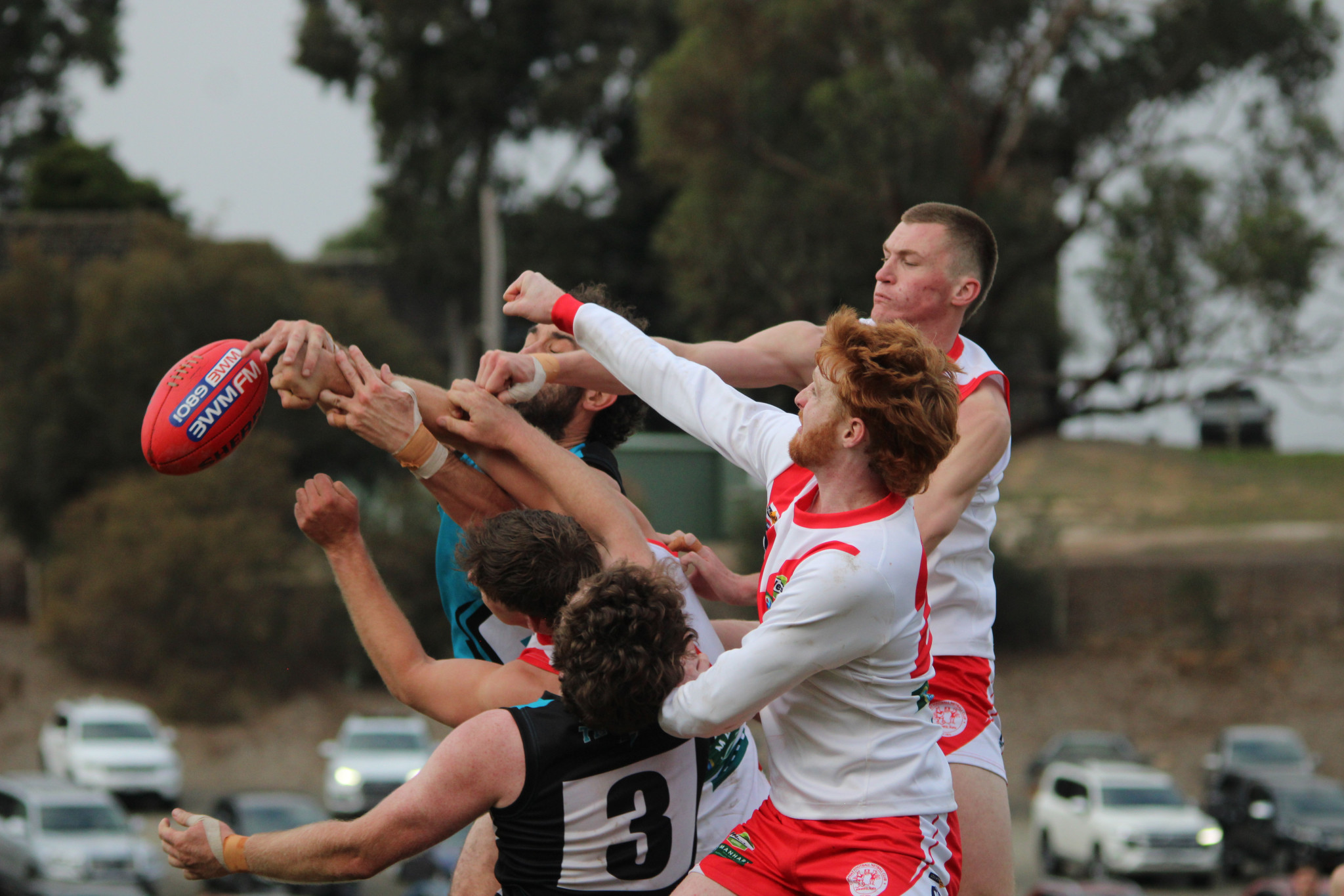 Players contest the ball. PHOTO: CHRIS GRAETZ