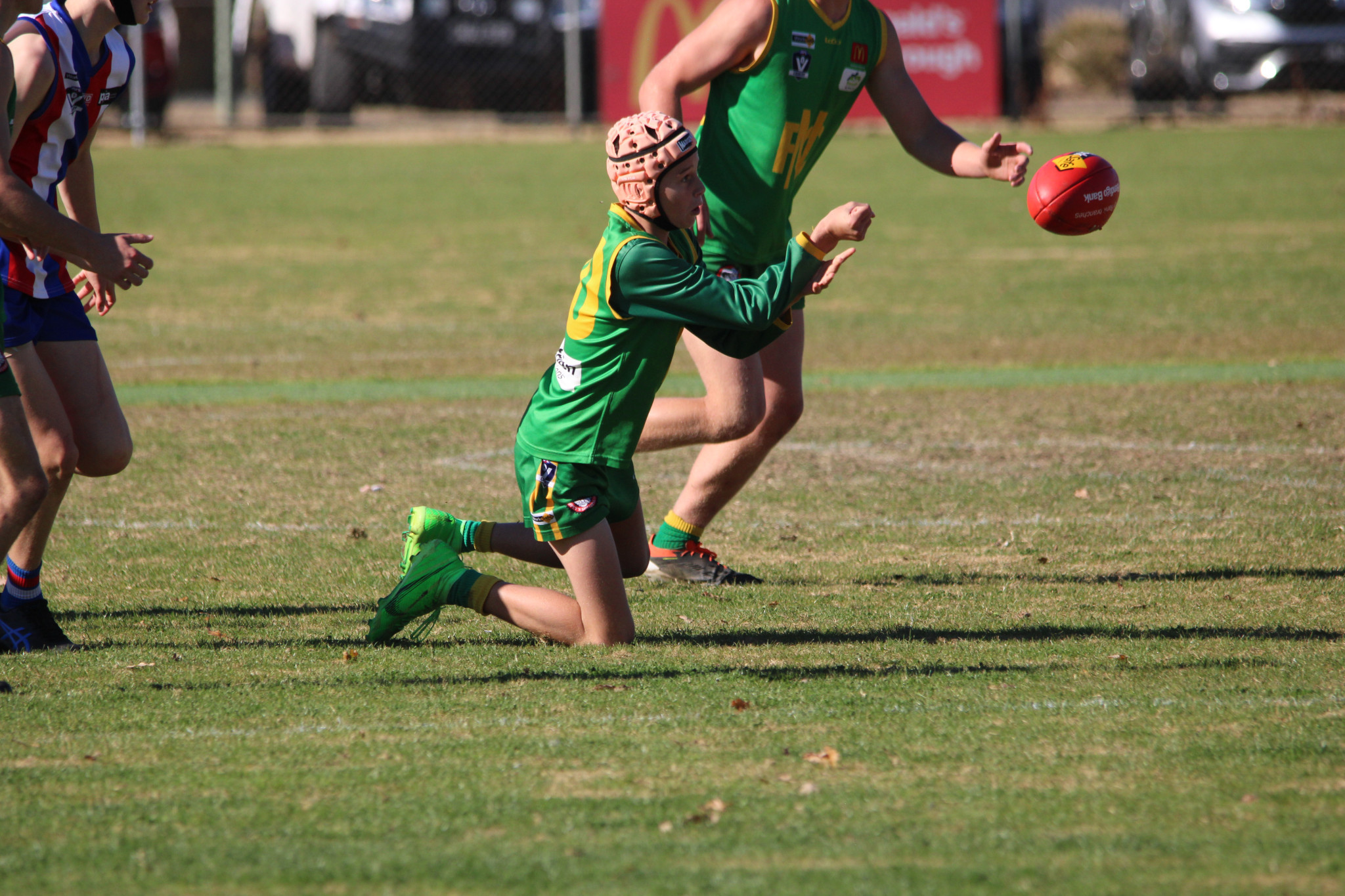 Grasshoppers’ Jack Sullivan gets a handball out. PHOTO: CHRIS GRAETZ