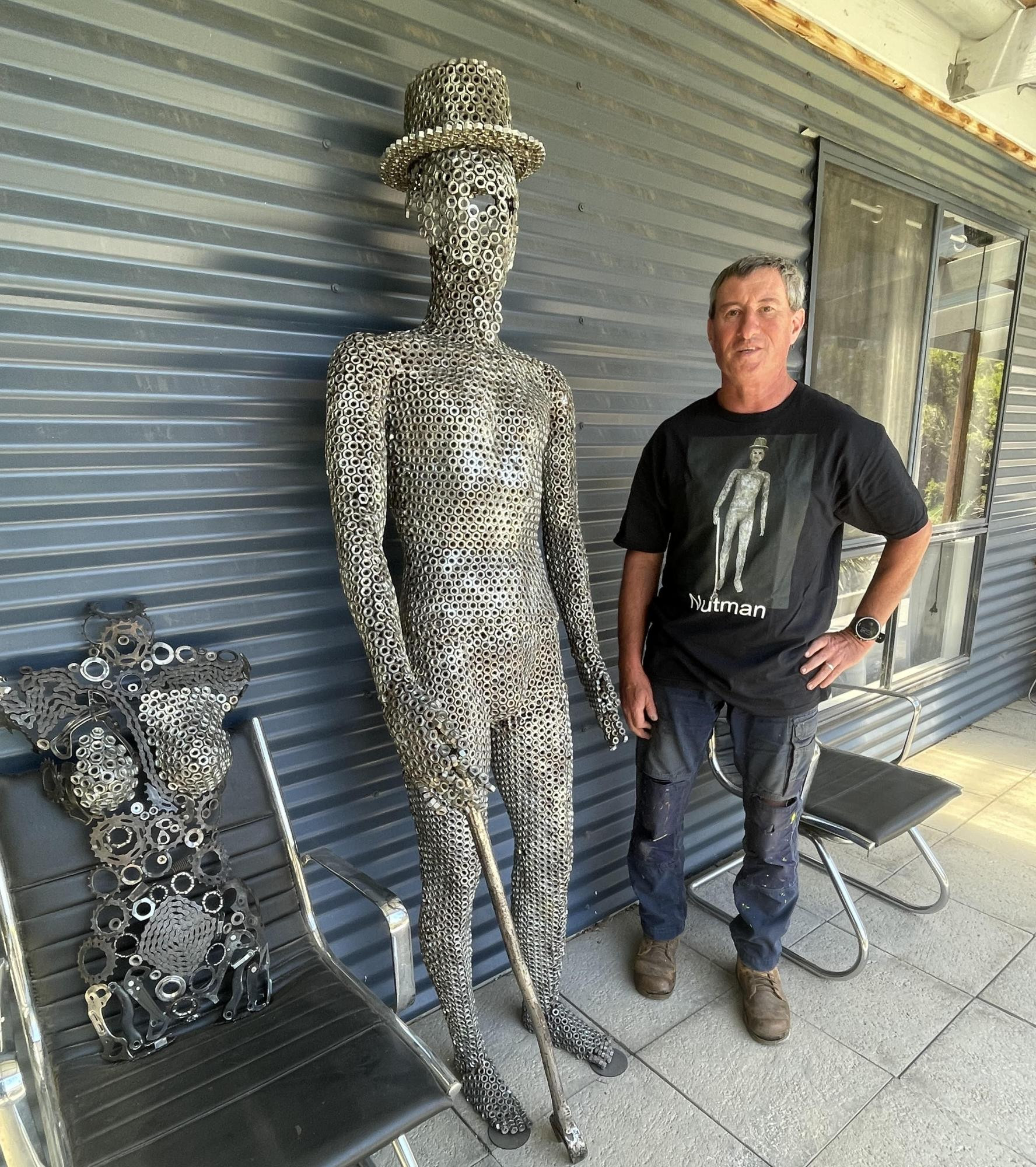Ararat sculptor Craig Shalders with his lifesize statue made from 3/8’ bolts. Picture by Sheryl Lowe