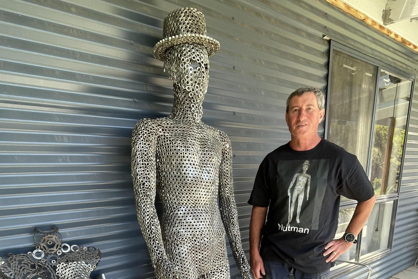 Ararat sculptor Craig Shalders with his lifesize statue made from 3/8' bolts. Picture by Sheryl Lowe