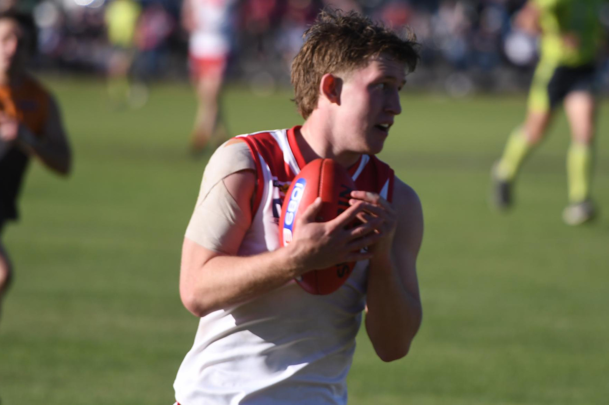 Henry Shea controls a mark close to the boundary during the WFNL grand final.