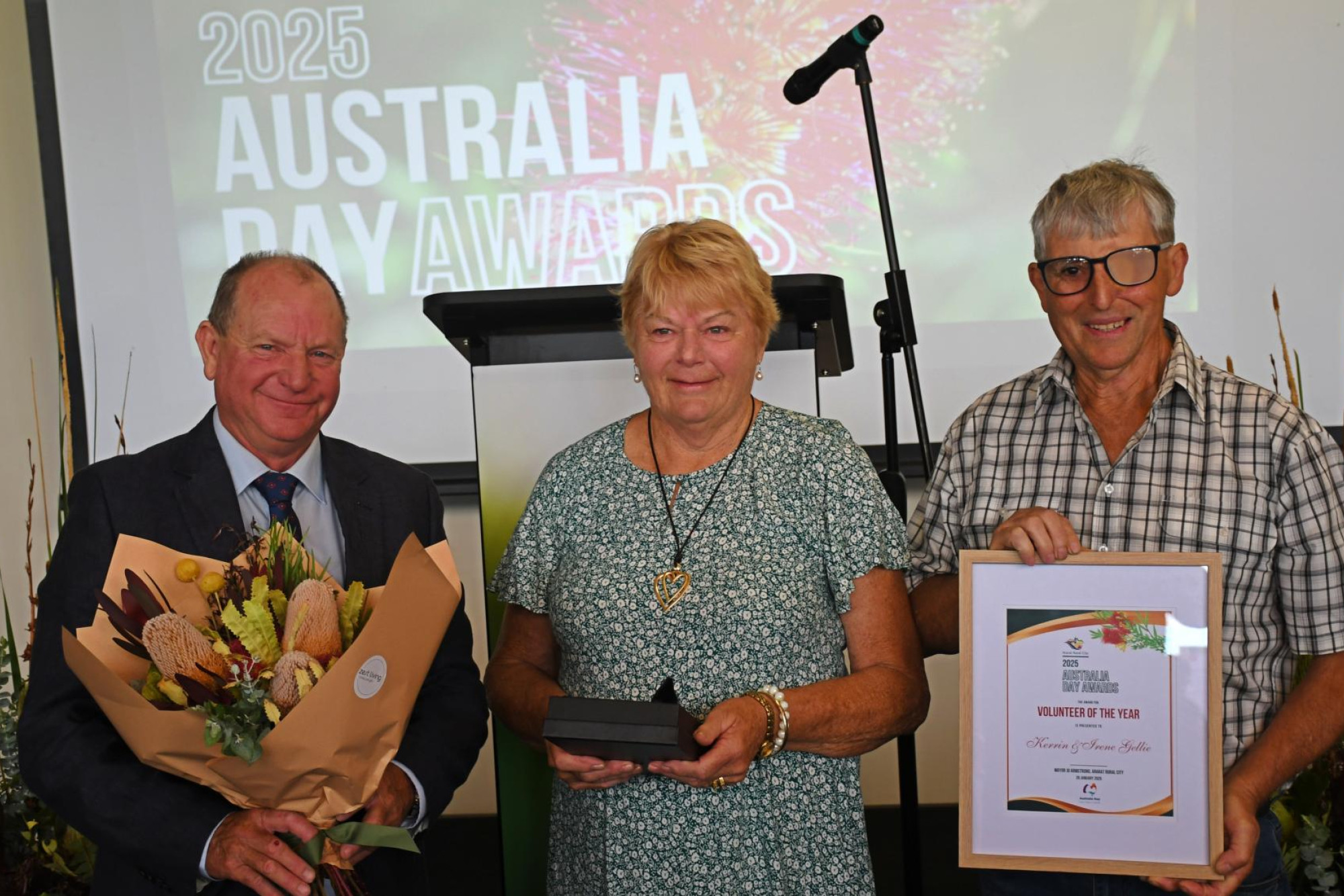 Deputy mayor Bob Sanders, left, present Kerrin and Irene Gellie with the Volunteer of the Year award. Picture by Ben Fraser