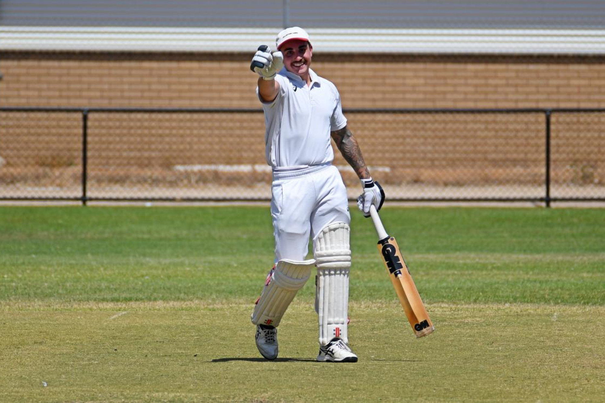 St Andrews' Reece Kettle celebrates his century against Halls Gap on Saturday, February 22. Picture by Ben Fraser