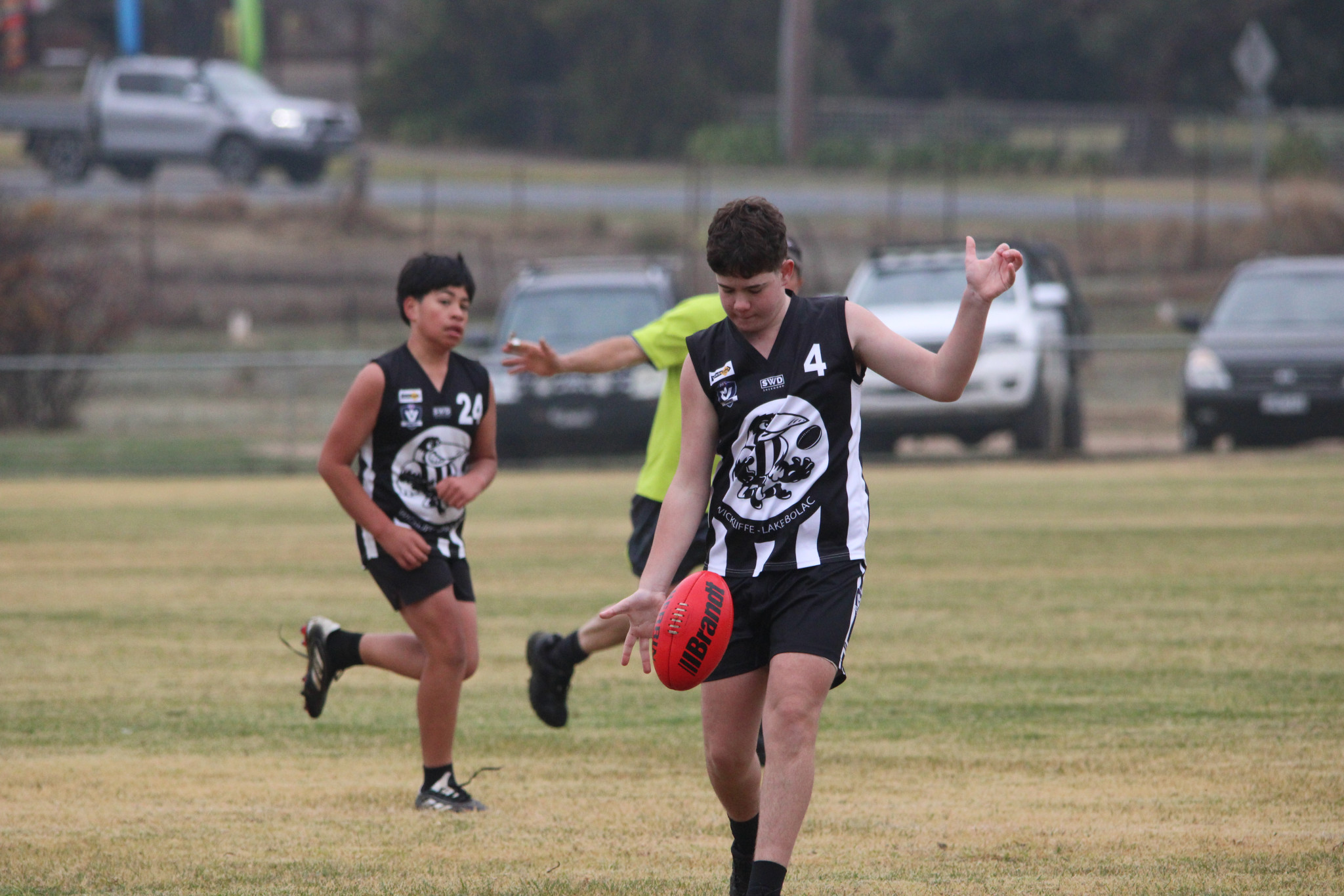 Kaden Thornton (Magpies) carefully watches the ball on his boot as he kicks towards a teammate on the wing. PHOTO: CHRIS GRAETZ