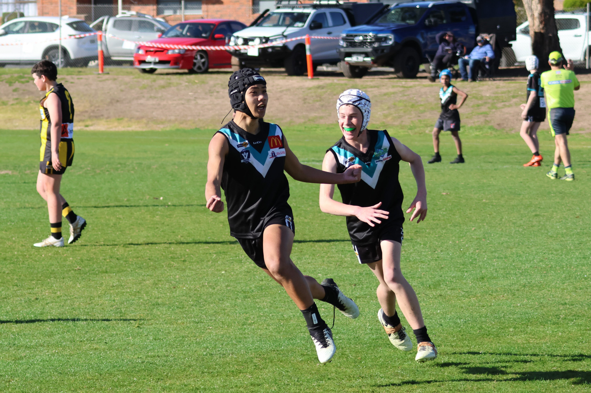 Xyrus Gragasin celebrates one of his five goals with teammate Ethan Parker. PHOTO: TRISH RALPH