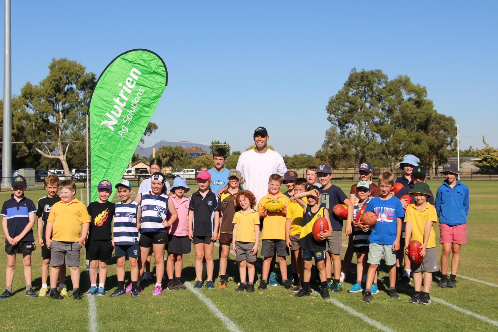 Kids play a few rounds against Ex Geelong star Tom Hawkins.