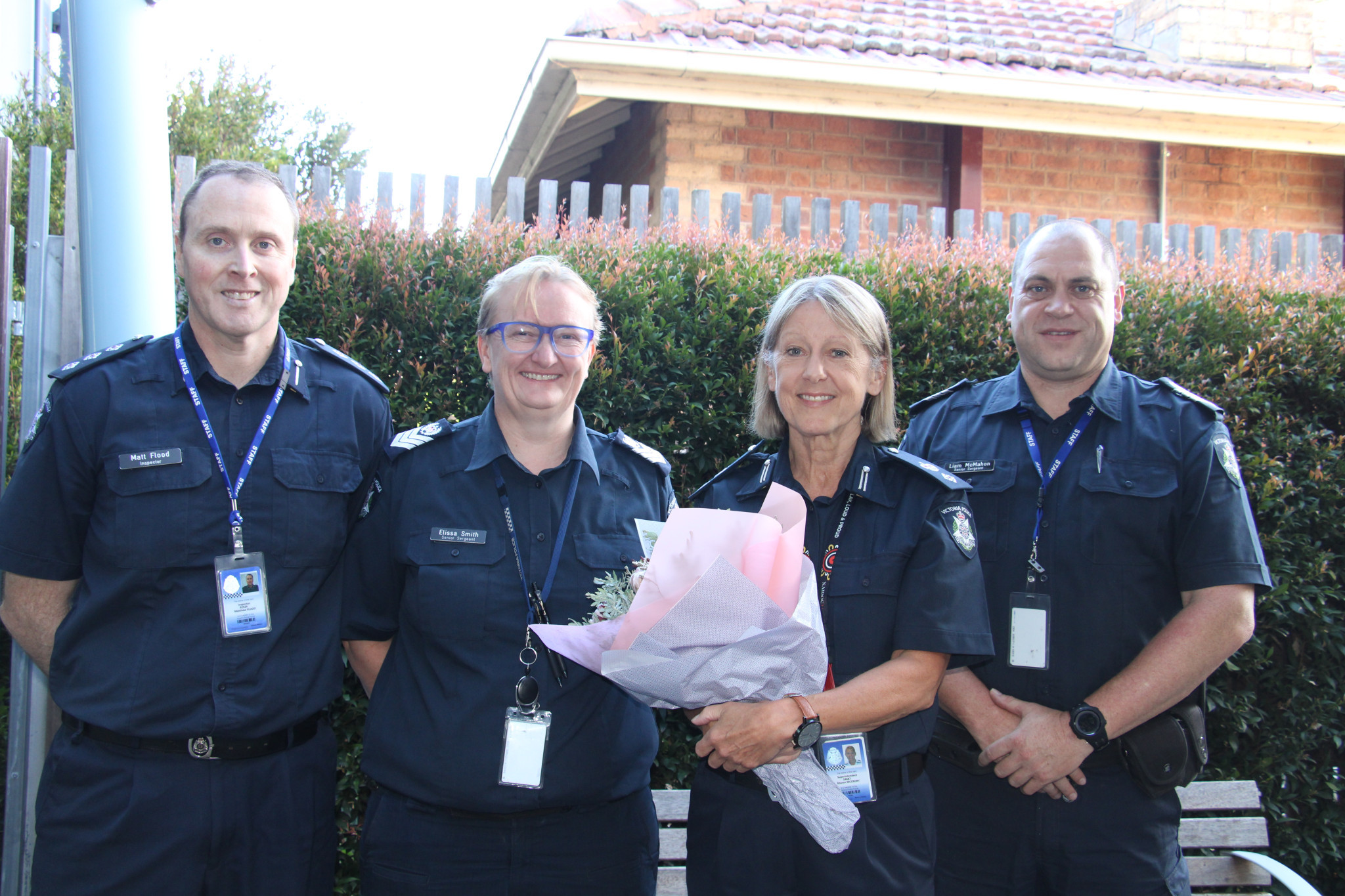 Inspector Matt Flood, Senior Seargeant Elissa Smith join Senior Seargent Liam McMahon to celebrate Superintendent Sharon McCrory's (centre) 40 years of service.