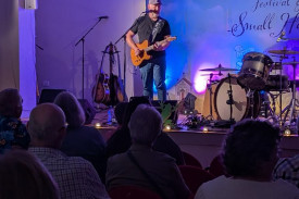 Local performer Dave Nicholson hits the stage.