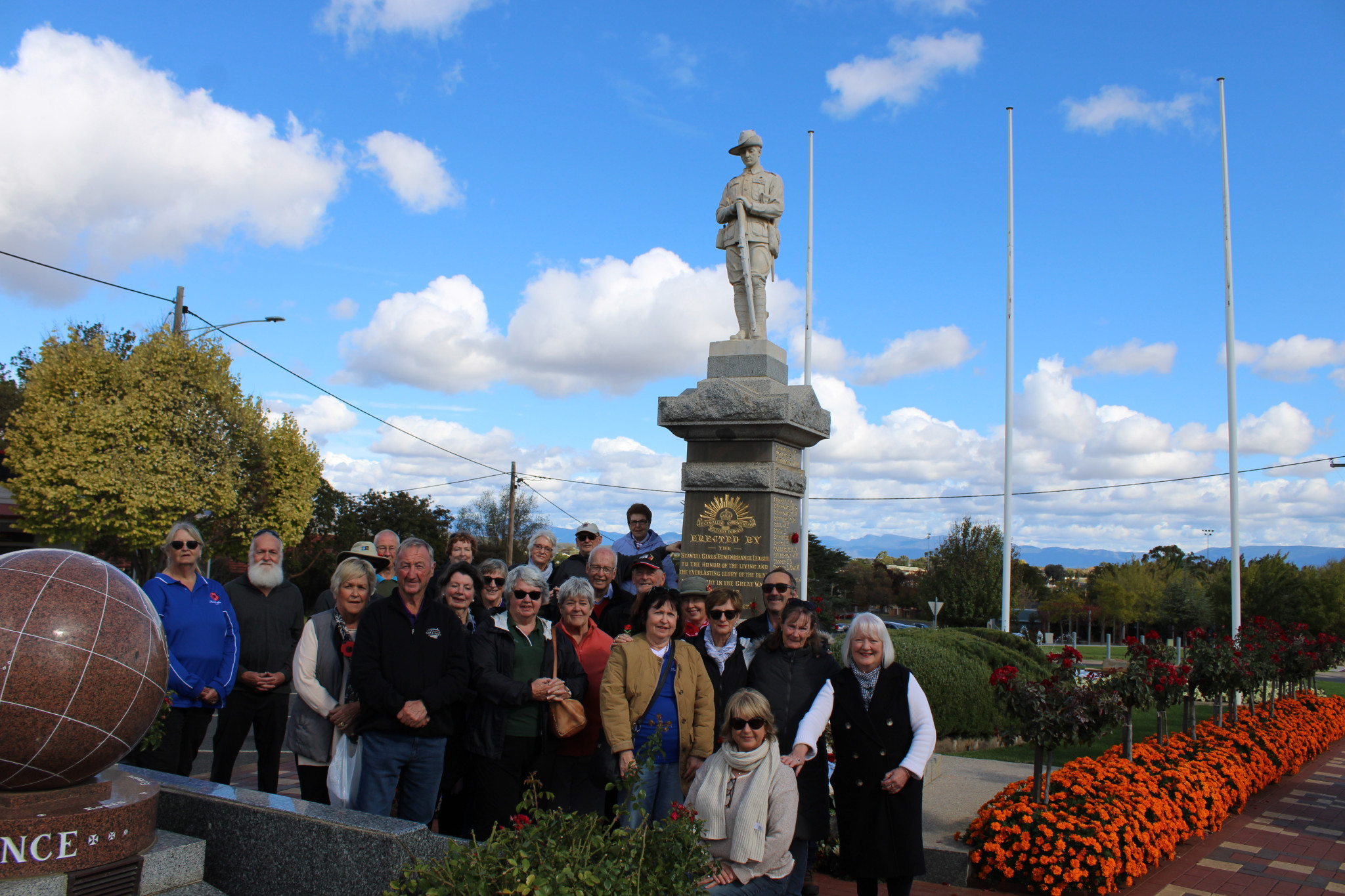 Debi Gramson (far right) and her tour group at the Stawell war memorial on Tuesday, April 29.