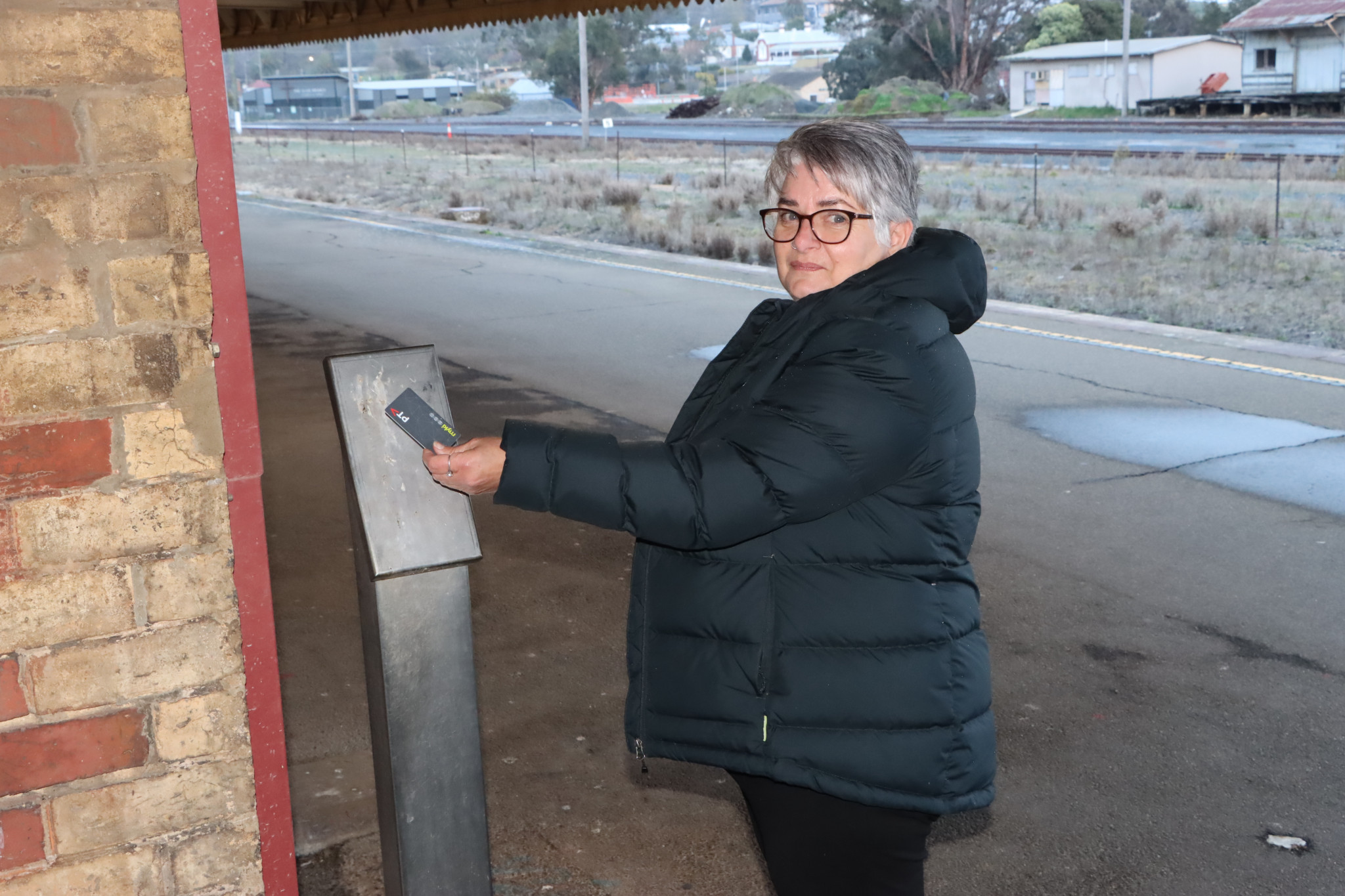 Regular train traveller Leanne Ryan tries to use the MyKi pad at Ararat Railway Station which has never been connected.