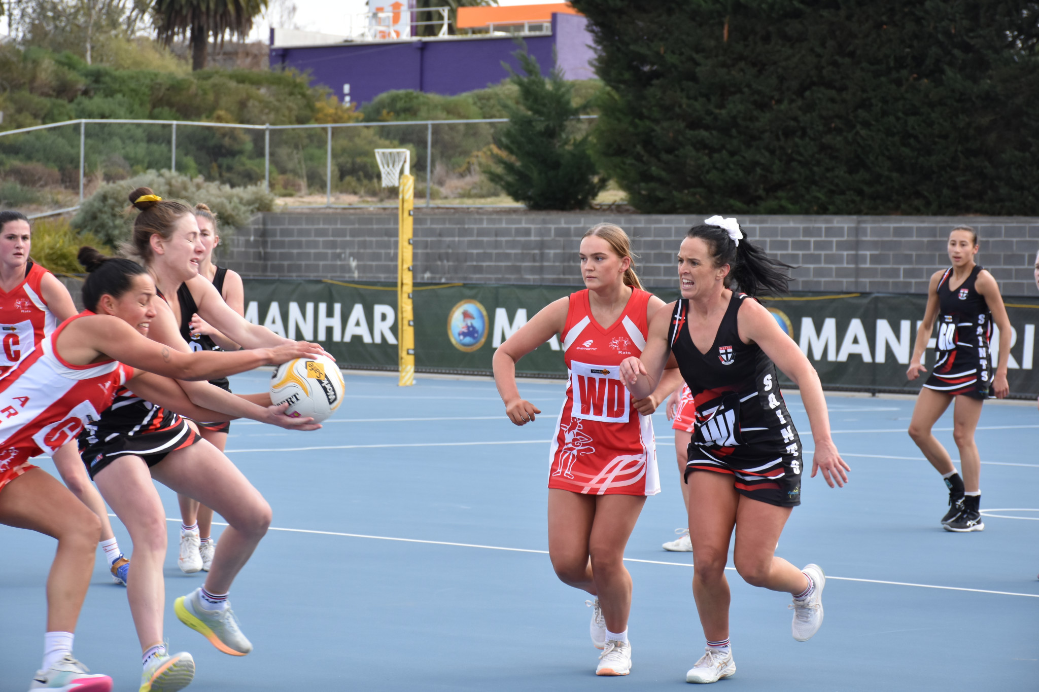 Abby Hallam (Saints) and Paige Biddle (Rats) battle for the ball with Tash Noble (Rats) and Megan Byrne (Saints) ready to lend support. PHOTO: SHARON BASSETT
