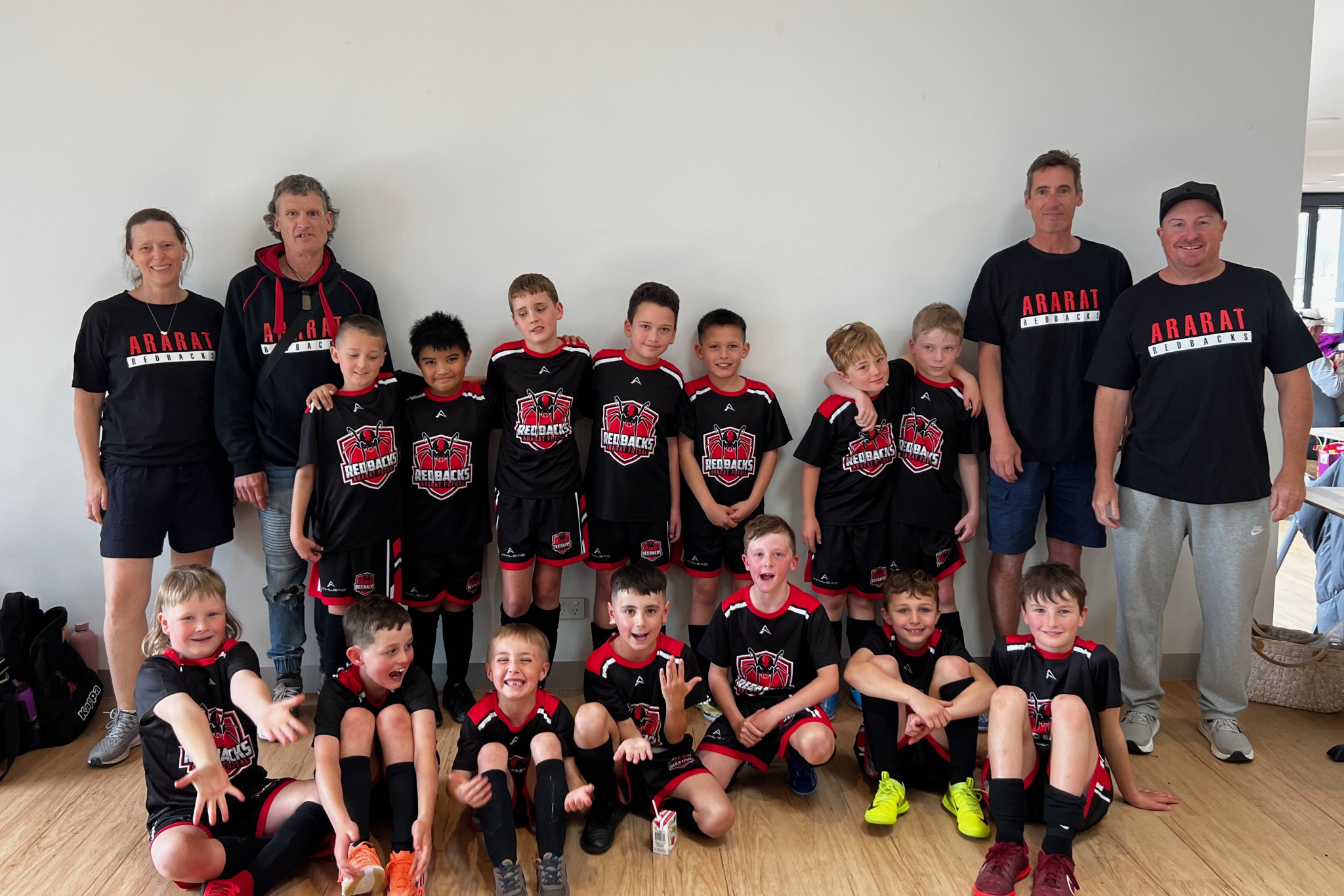 Ararat Redbacks U8 and U10 teams with coaches and team managers present at the Victorian State Futsal Championships.