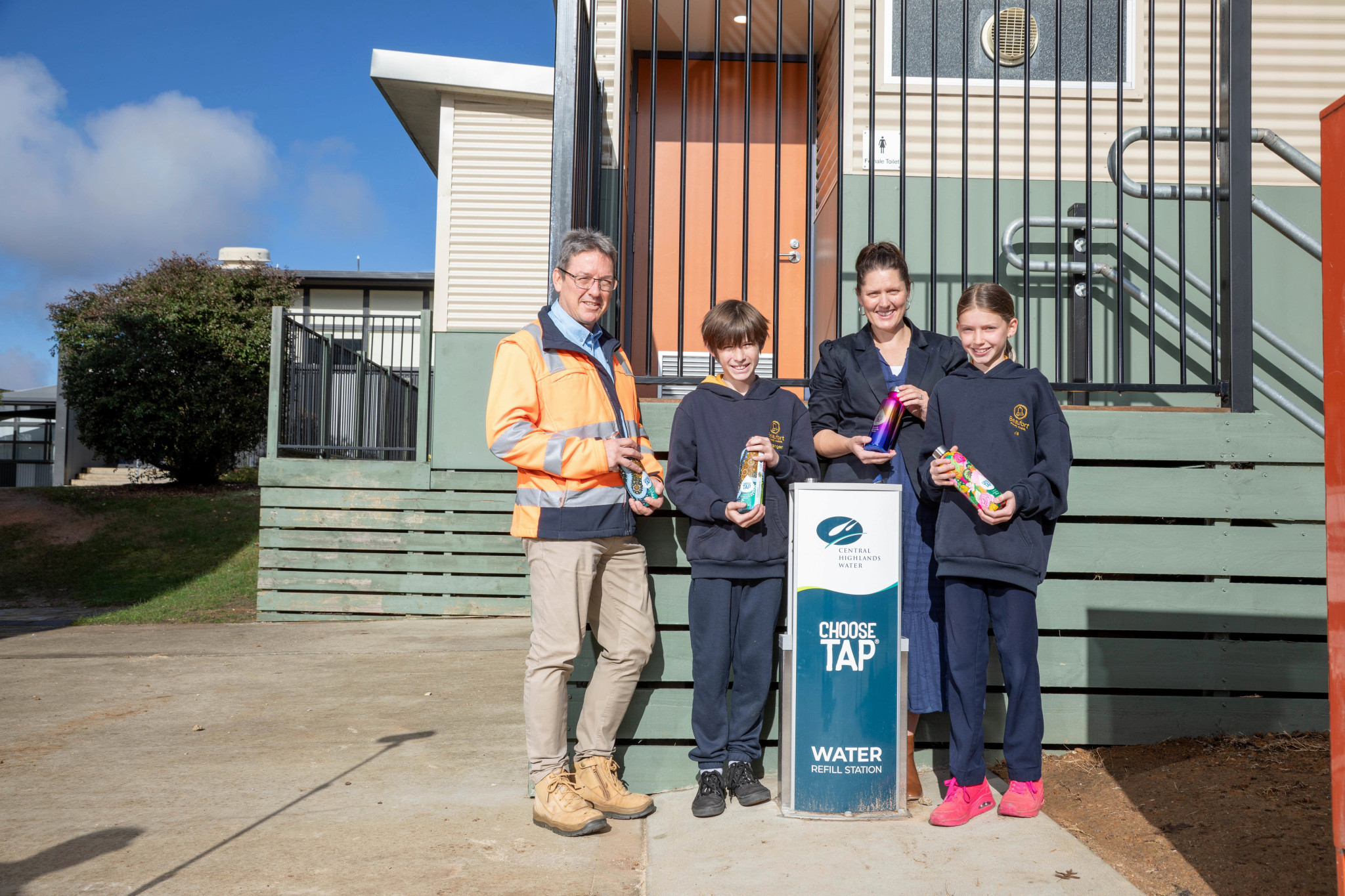 Central Highlands Water Head of Environmental Services Carsten Berberich and Pyrenees Shire Mayor Councillor Tanya Kehoe are joined by school captains Henry and Lyla from Beaufort Primary School at the new Choose Tap water fountain.