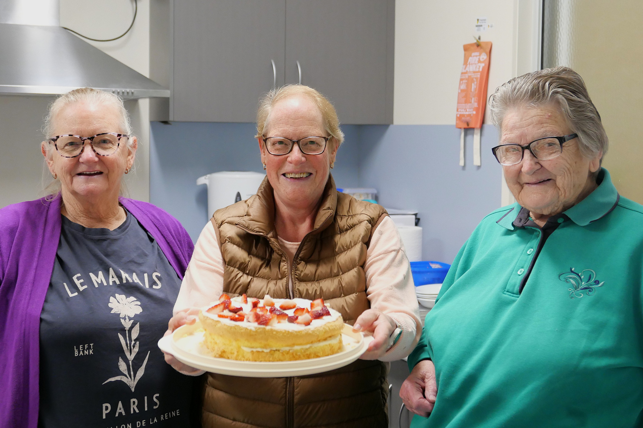 Care For A Cuppa volunteers from left, Sheryl Nitschke, Bron Mackley and Joan O’Callaghan getting ready for a birthday celebration on Tuesday.