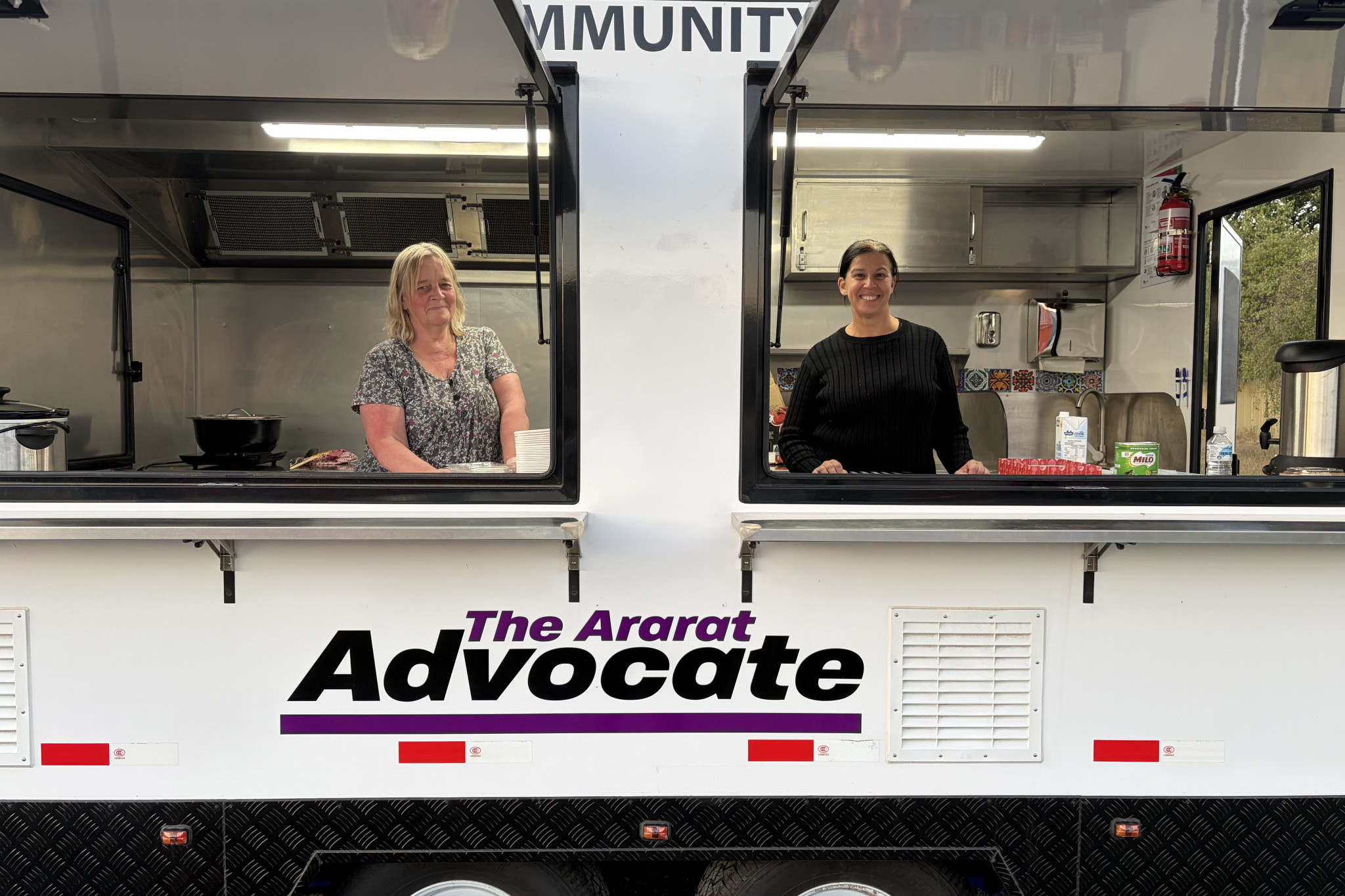 Volunteers Tacey O’Brien and Janelle Smith are serving up to 35 meals each Wednesday night.