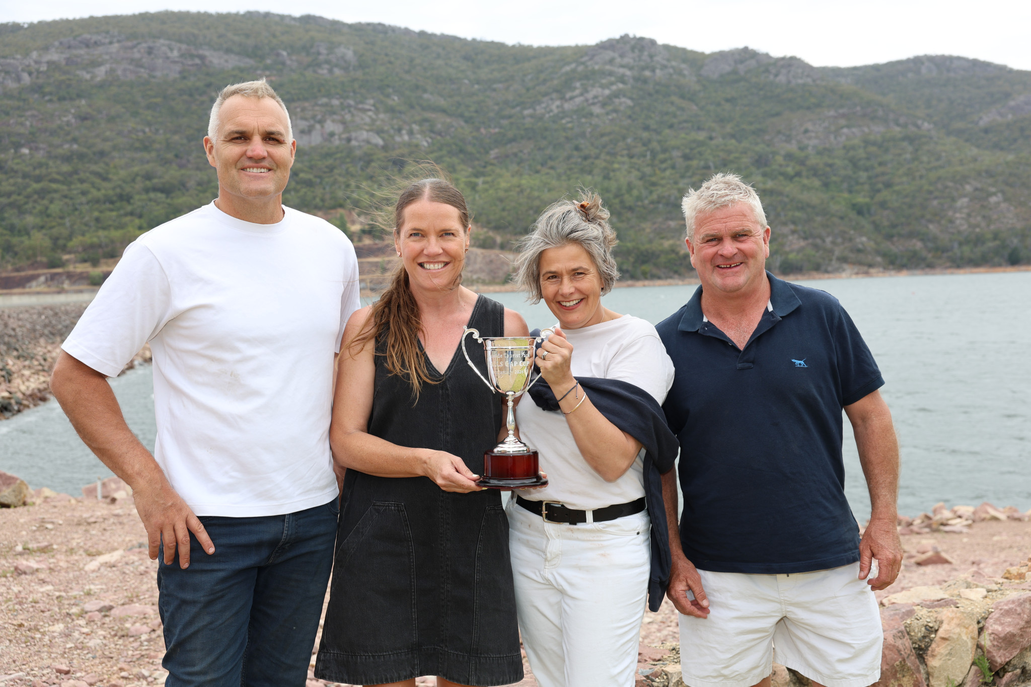 From left, local horse trainer Andrew Bobbin, Stawell Racing Club manager Penny Penfold, and Lakeside Holiday Park operators Josephina and Rohan McDonald were all smiles at Halls Gap's iconic Lake Bellfield this week to promote Sunday's Halls Gap Cup. Photo by Henry Dalkin.