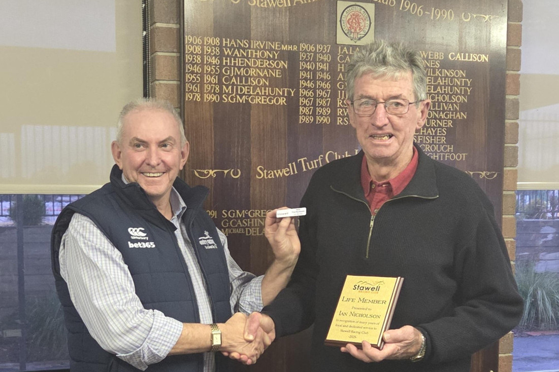 Ian Nicholson (right) receives his life membership from Country Racing Victoria CEO, Scott Whiteman.
