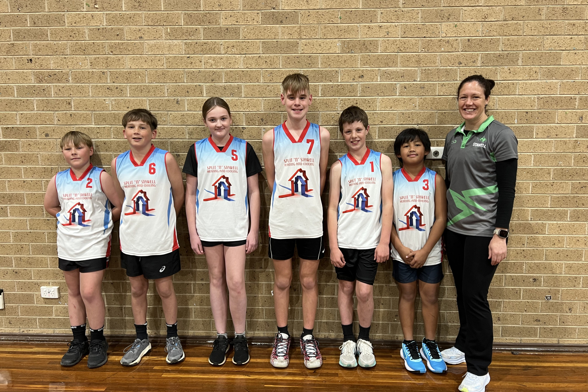 The 2025 under-14 premiers Split and Stawell. L-R: Jax Skurrie, Charlie Sullivan, Chloe Pearce, Blayze Kenny, Sam Margetson, Jacob Matthew Ramos, Jemma Clarkson (Coach).