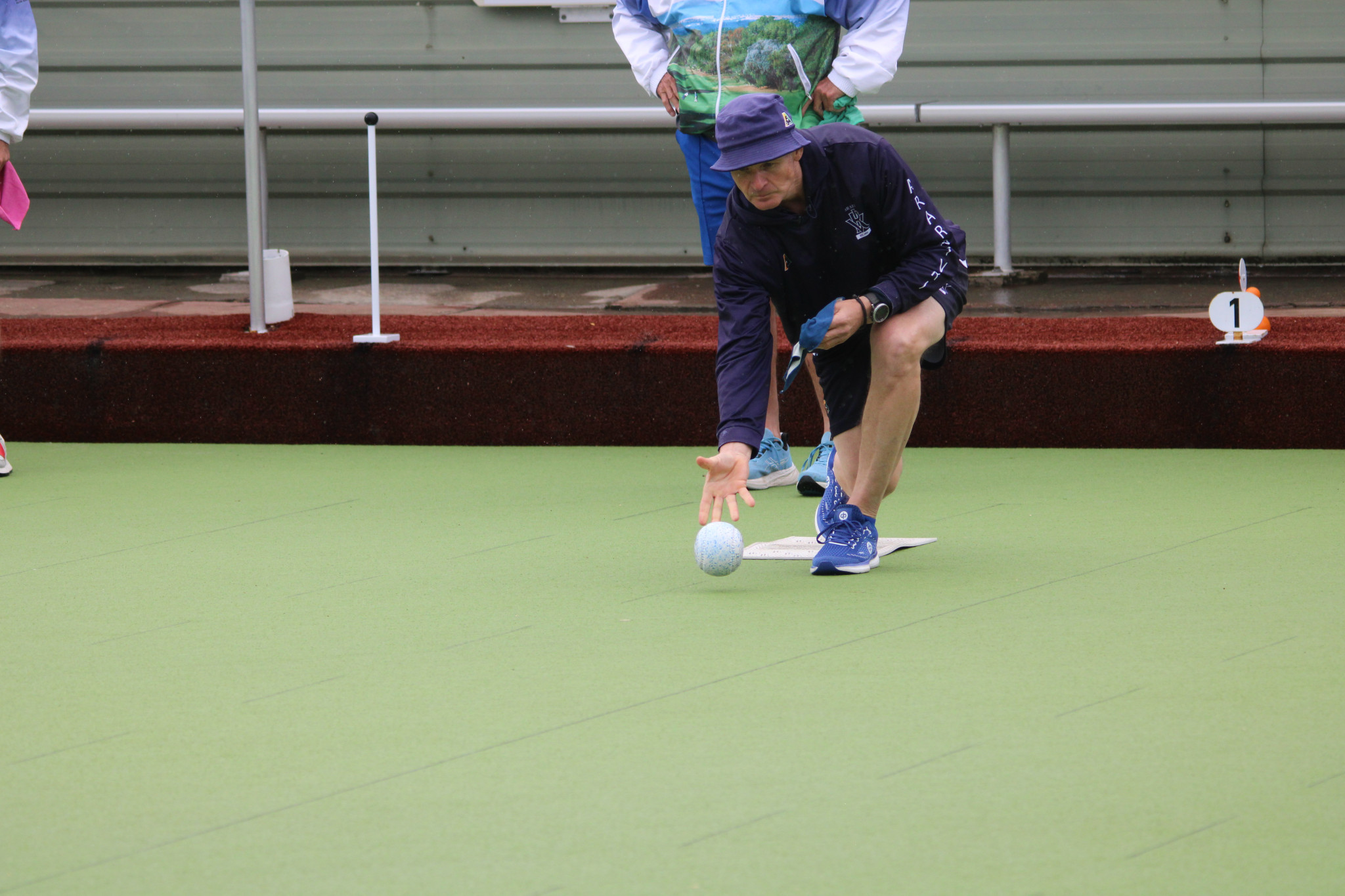 Ararat VRI's skip Clayton Holcombe carefully bowls his first bowl to finish off an end.