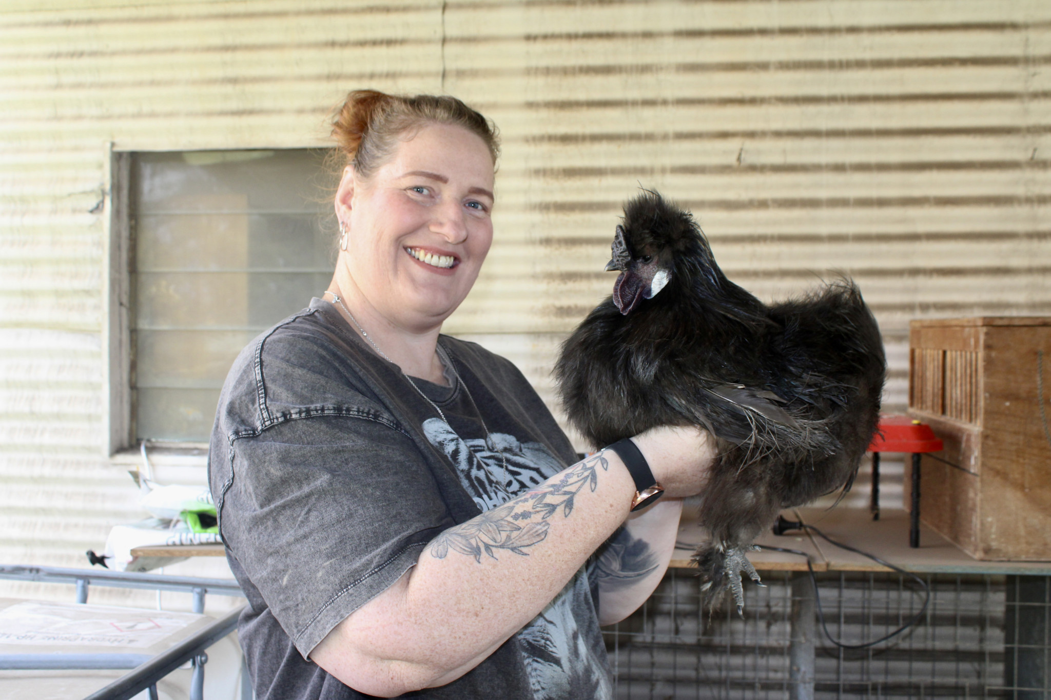Lisa Mitchell at home in Snake Valley with her prize winning chicken, Buddy.
