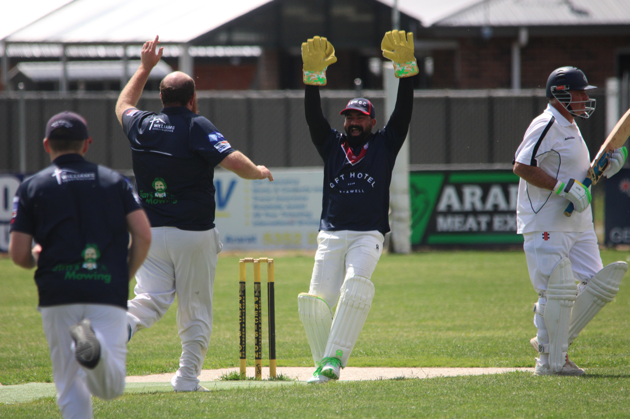 Combine’s wicketkeeper Sandeep K Raju celebrates a wicket.