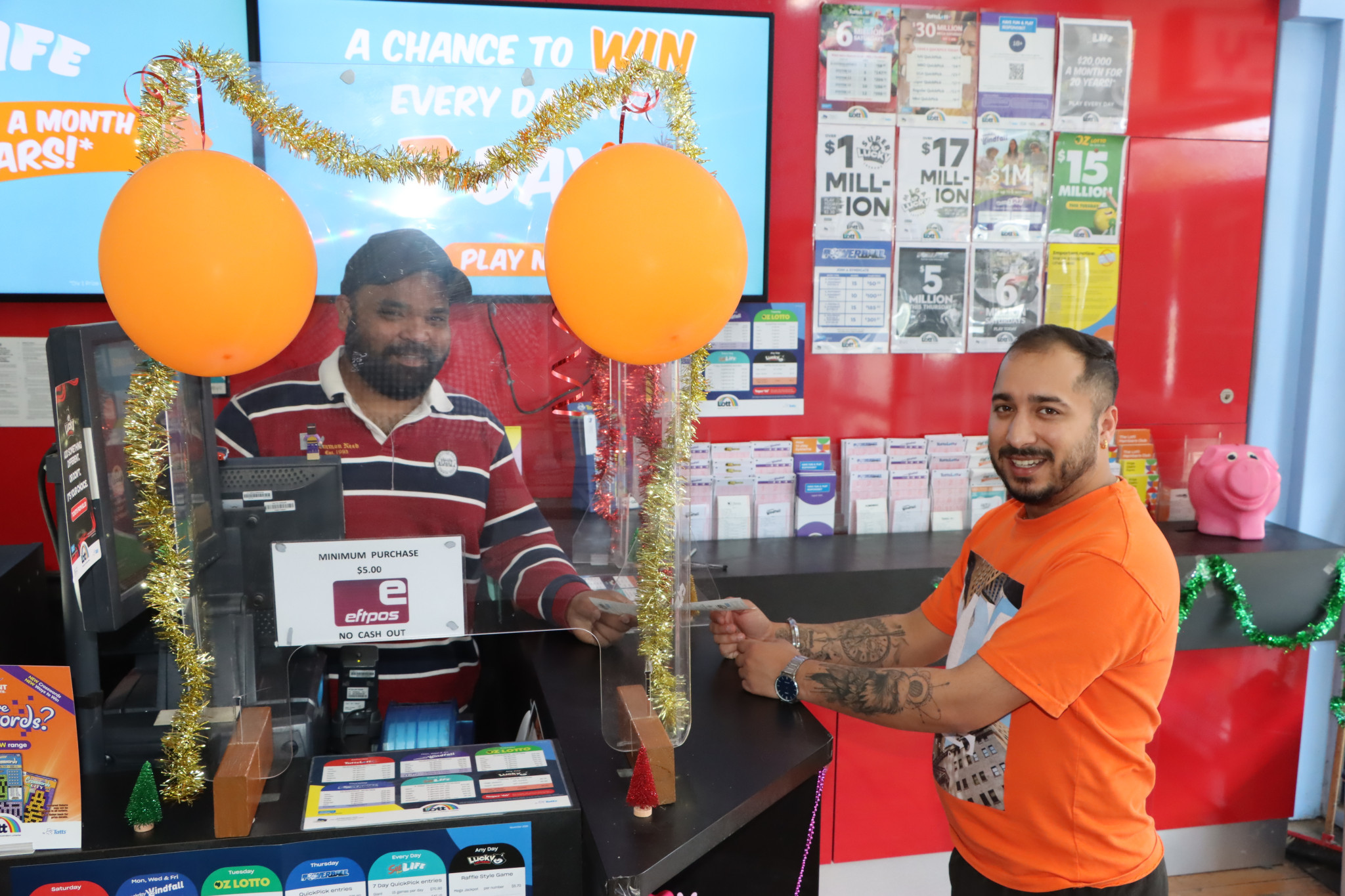 Customer Daksh (right) hopes he too will be lucky with the purchase of a Tattslotto ticket from Ararat News and Lott’s Sushanth Kommu.