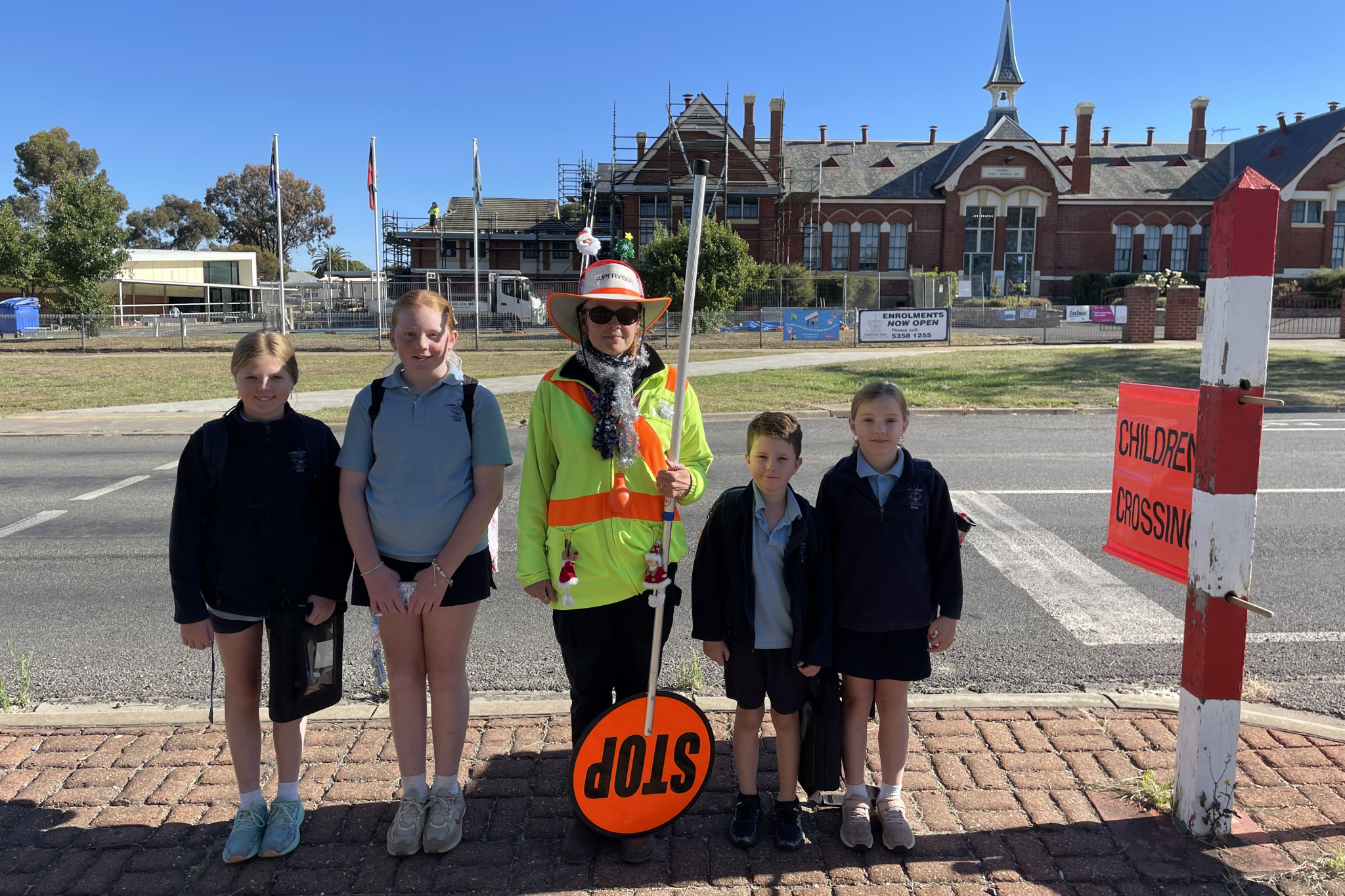 Arli, Lily, Kerry, Patrick, Mackenzie are ecstatic that supervised school crossings will stay.