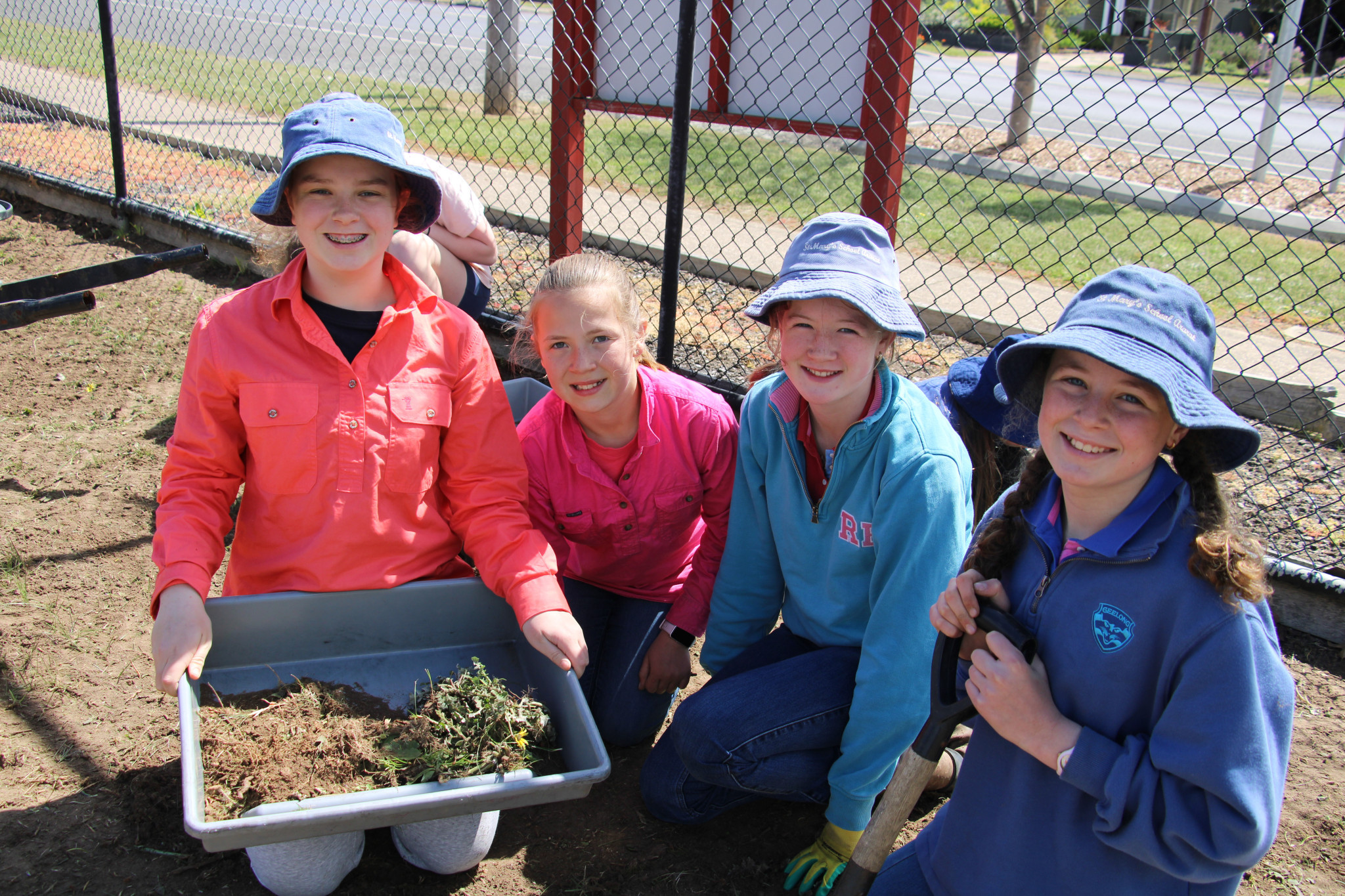 Georgie, Isobel, Libby and Scarlett are busy helping with a working bee after a donation of mulch from Ararat Rural City Council.