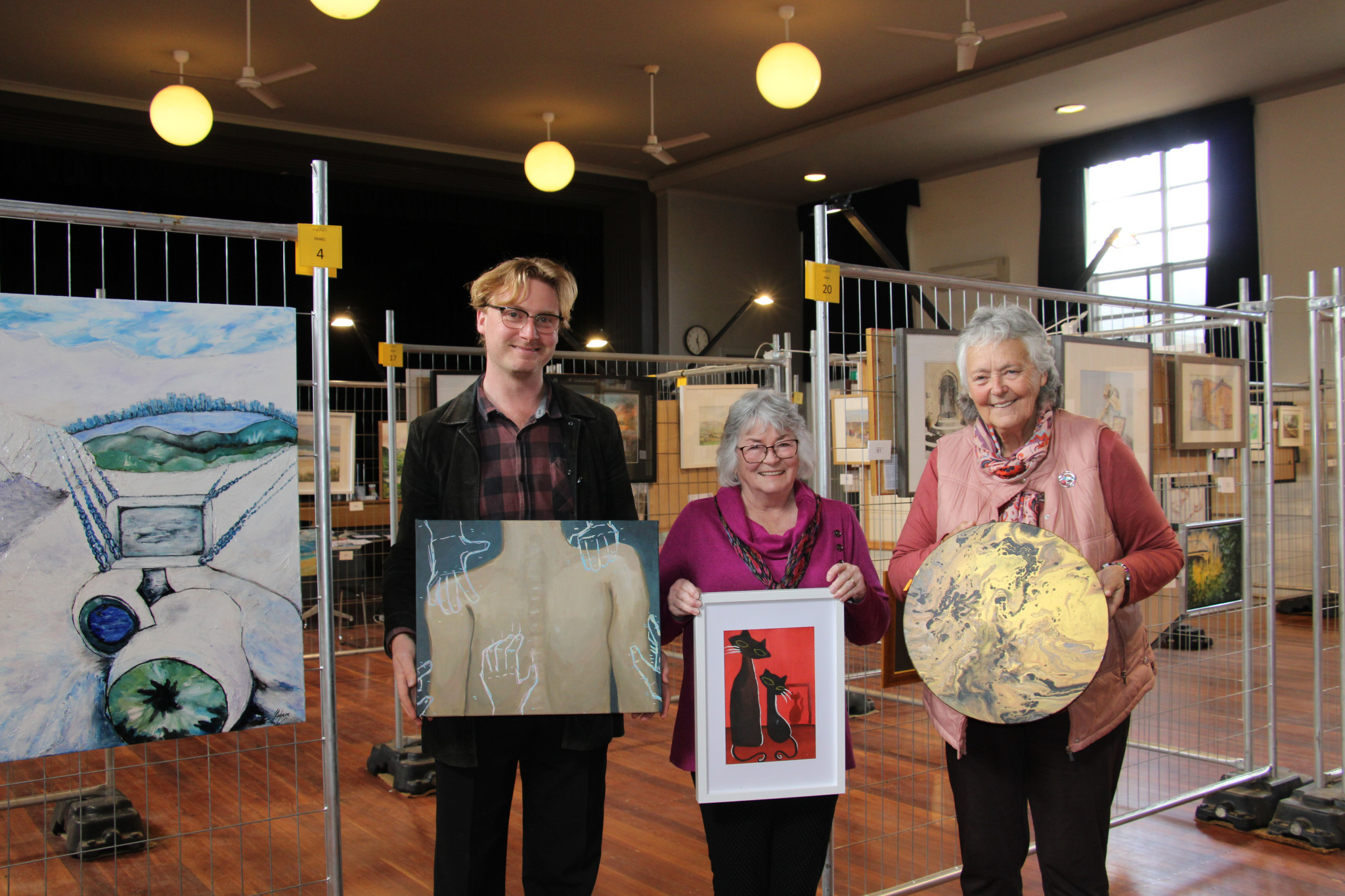 Callan Skimin, Jenny Grant and Marg Pilgrim set up the Avoca Art show ready for tonight opening.