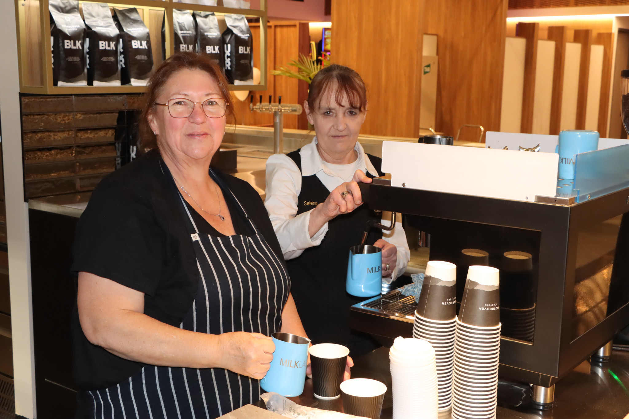 Lois Johnson and Selina Carter try out the new coffee machine.