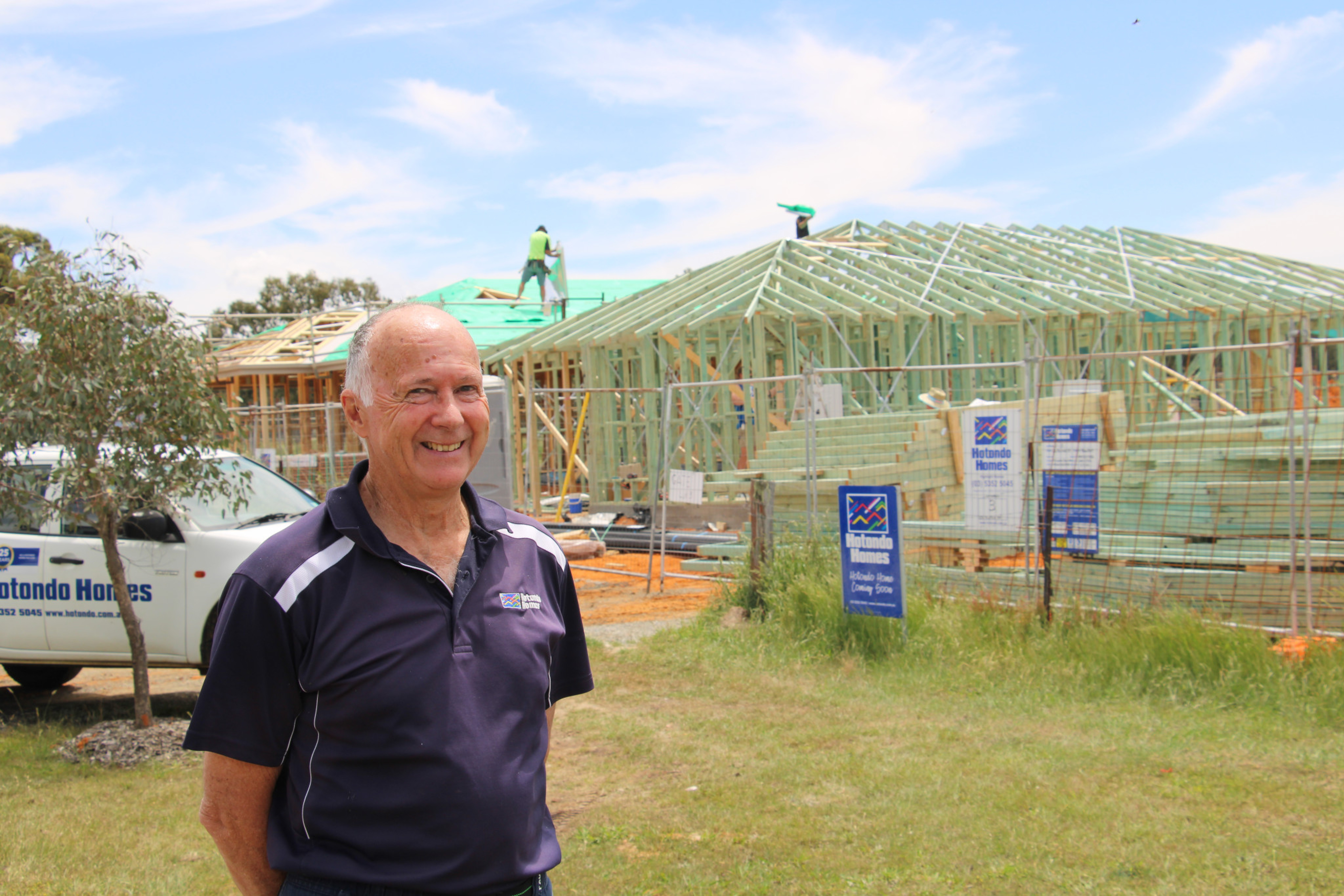 Hotondo Homes’ Russell Pearse assesses the work underway on new homes in Burke Street Beaufort.