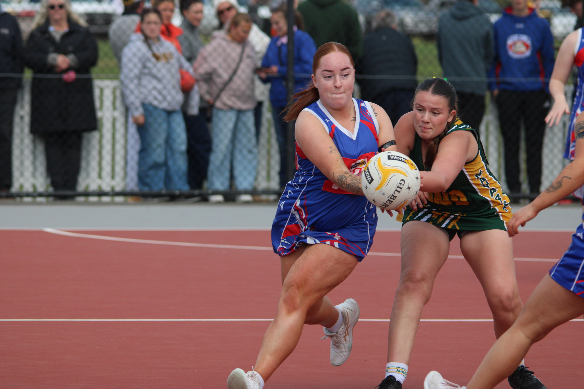 Grasshoppers' C-Grade netballer Talyra Bibby battles Bulldogs' Talia Arrowsmith for the ball. PHOTO: CHRIS GRAETZ