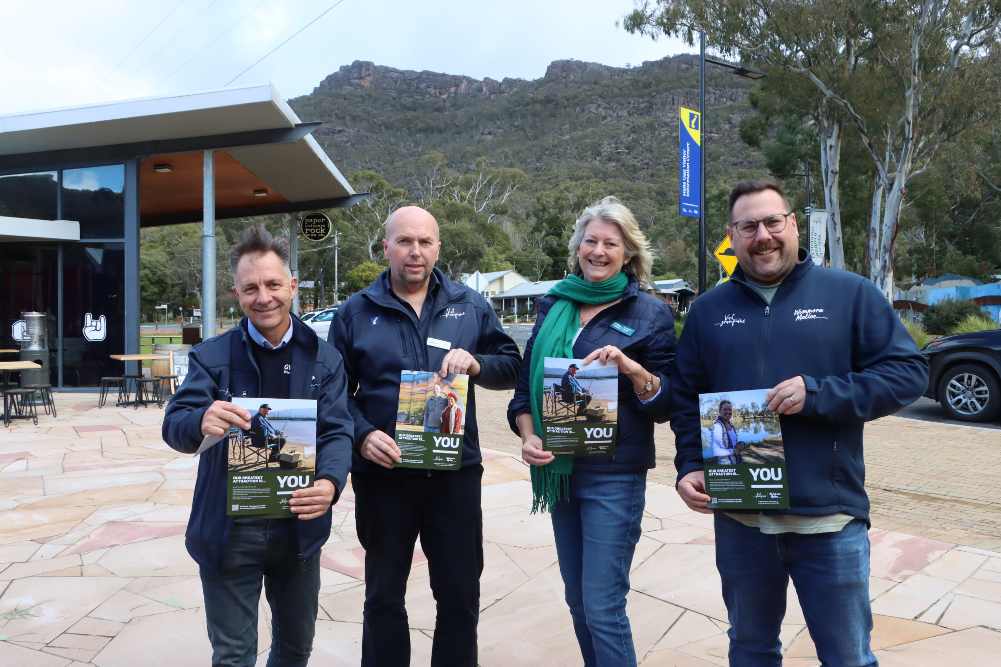 Grampians Wimmera Mallee Tourism CEO Marc Sleeman, Tourism Services Officer Tim Warner, Northern Grampians Mayor Karen Hyslop and Tourism Partnership Manager Ian Gumela promote the new YOU campaign in Halls Gap recently. Photo by Craig Wilson.
