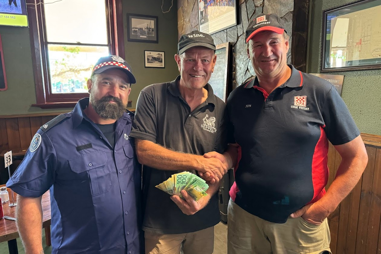 Great Western CFA volunteer Tim Jovanovic (left) and Second Lieutenant Jon Wilksch (right) with Seppelt Great Western's Bruce Achchow.