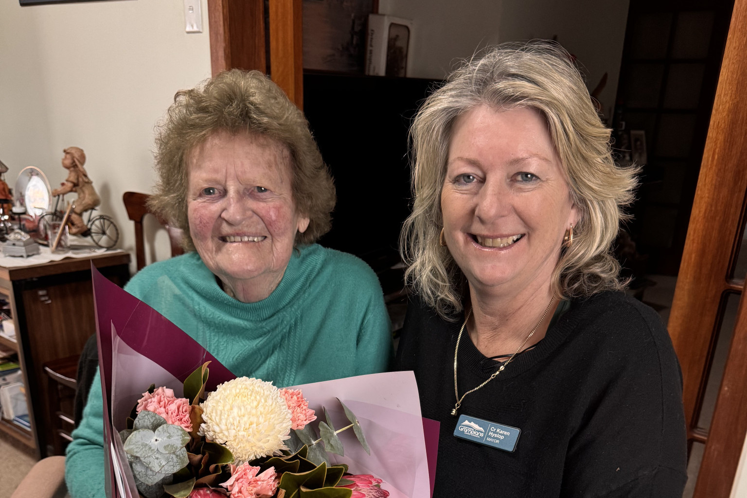 Northern Grampians Shire Mayor Karen Hyslop congratulates Stawell’s Maureen Hunter on her 90th birthday, presenting a bouquet of flowers on behalf of the council.