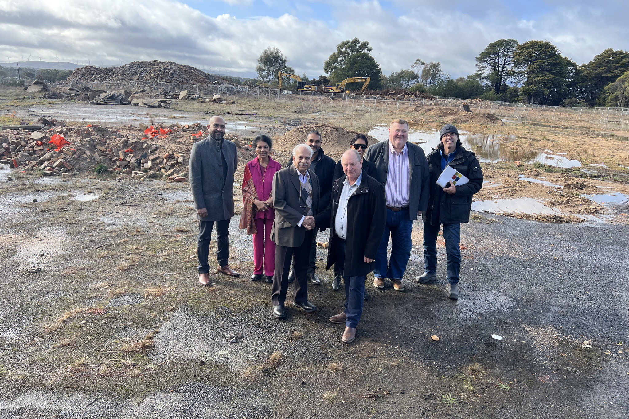 Big plans for the Prestige site. Pictured are Roshan Varughese, Kay Samuel, Sam Samuel, Shawn Samuel, Deputy Mayor Cr Bob Sanders, Shoba Samuel, Council CEO Dr Tim Harrison and John Matic at the site last Wednesday.