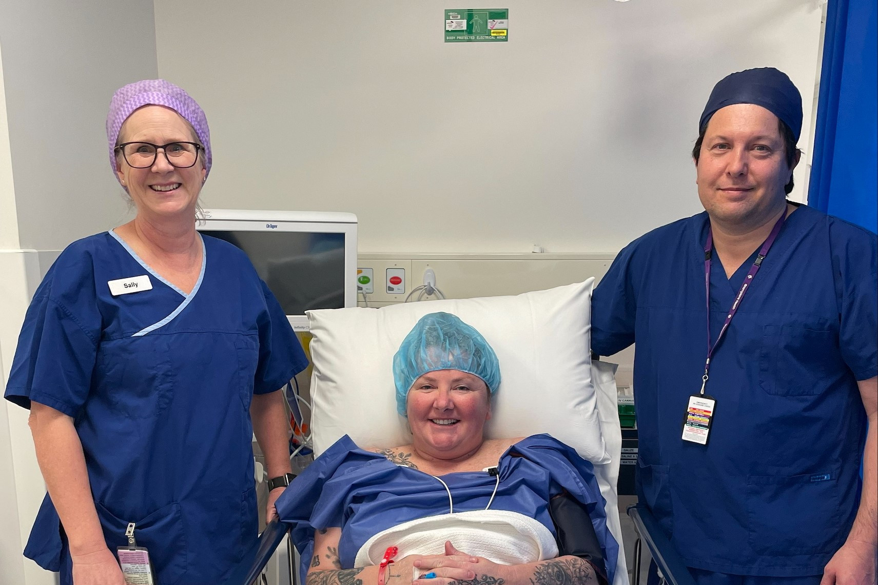 Patient Rachel Bird with Mr Ya’acov Leigh and Perioperative NUM Sally Hamilton in one of the new operating theatres.