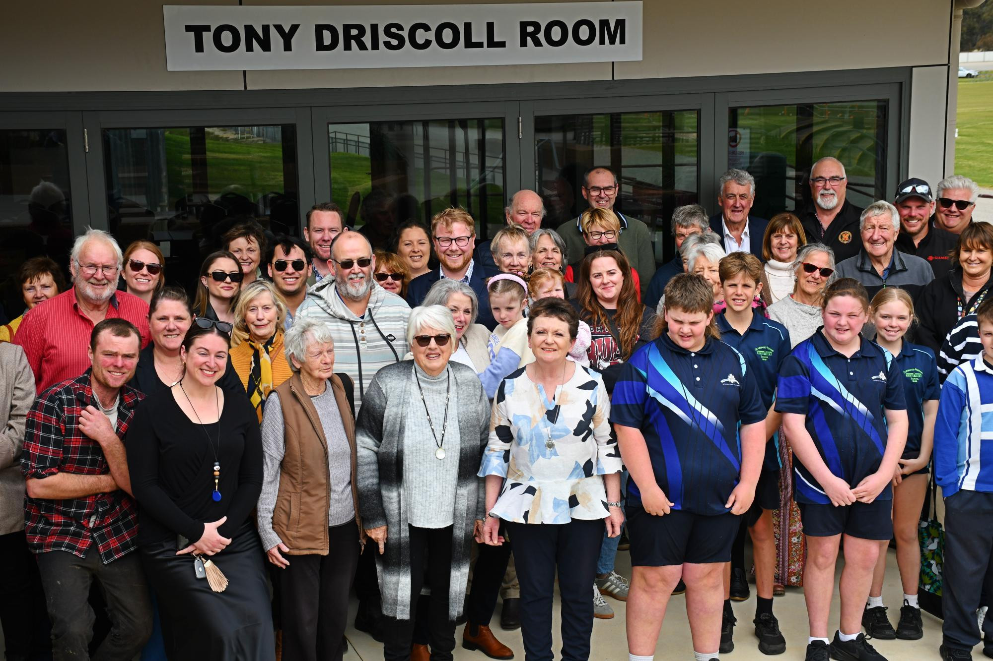 Annette Driscoll, middle, in front of the newly named Tony Driscoll Room at Lord Nelson Park in St Arnaud. Picture by Ben Fraser